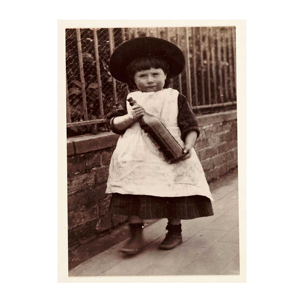 HULL008: Child Posing With Glass Bottle
