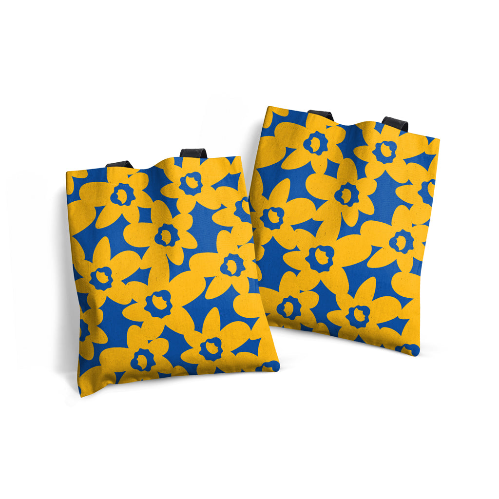 MACU015: Marie Curie Yellow Daffodils on Blue Edge-to-Edge Tote Bag - A Floral Hug Range